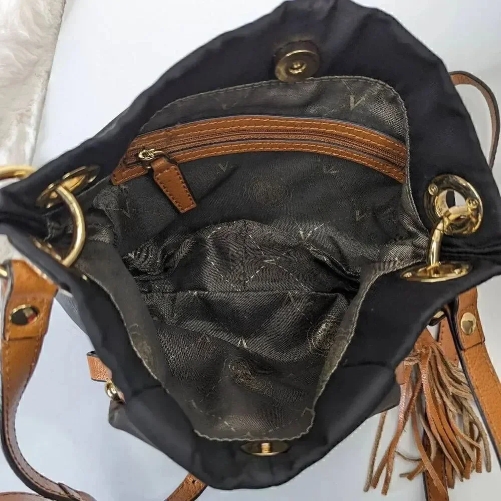 Vince Camuto Womens Sling Bag Adjustable Strap Tasseled Black and Brown